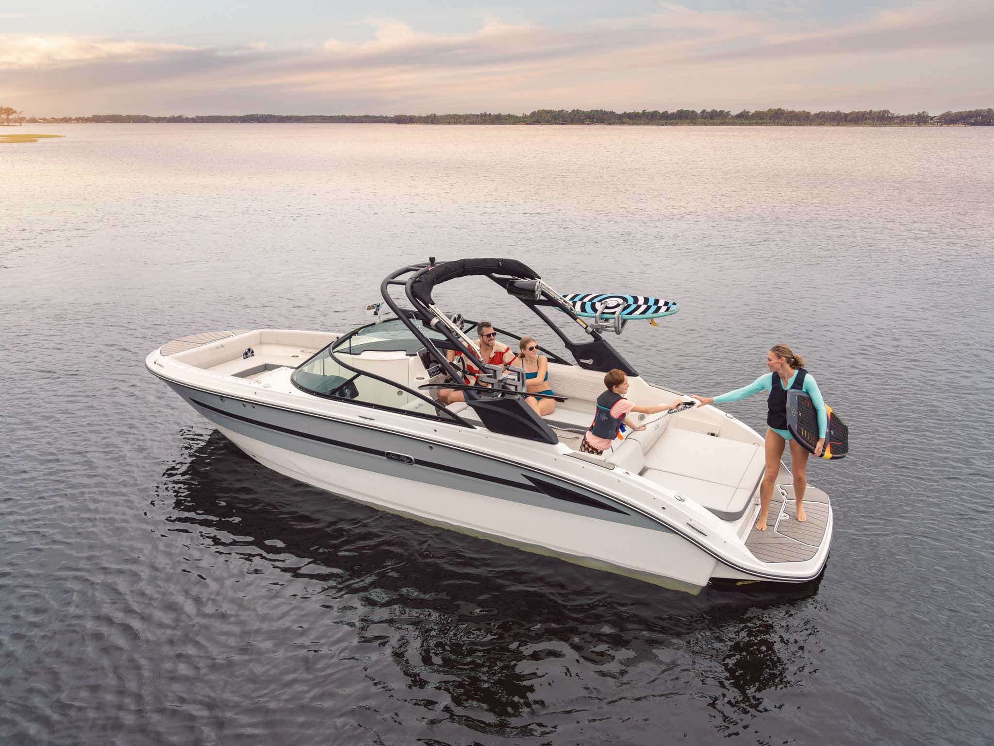 Family aboard an SDX 270 Surf preparing to go wakesurfing