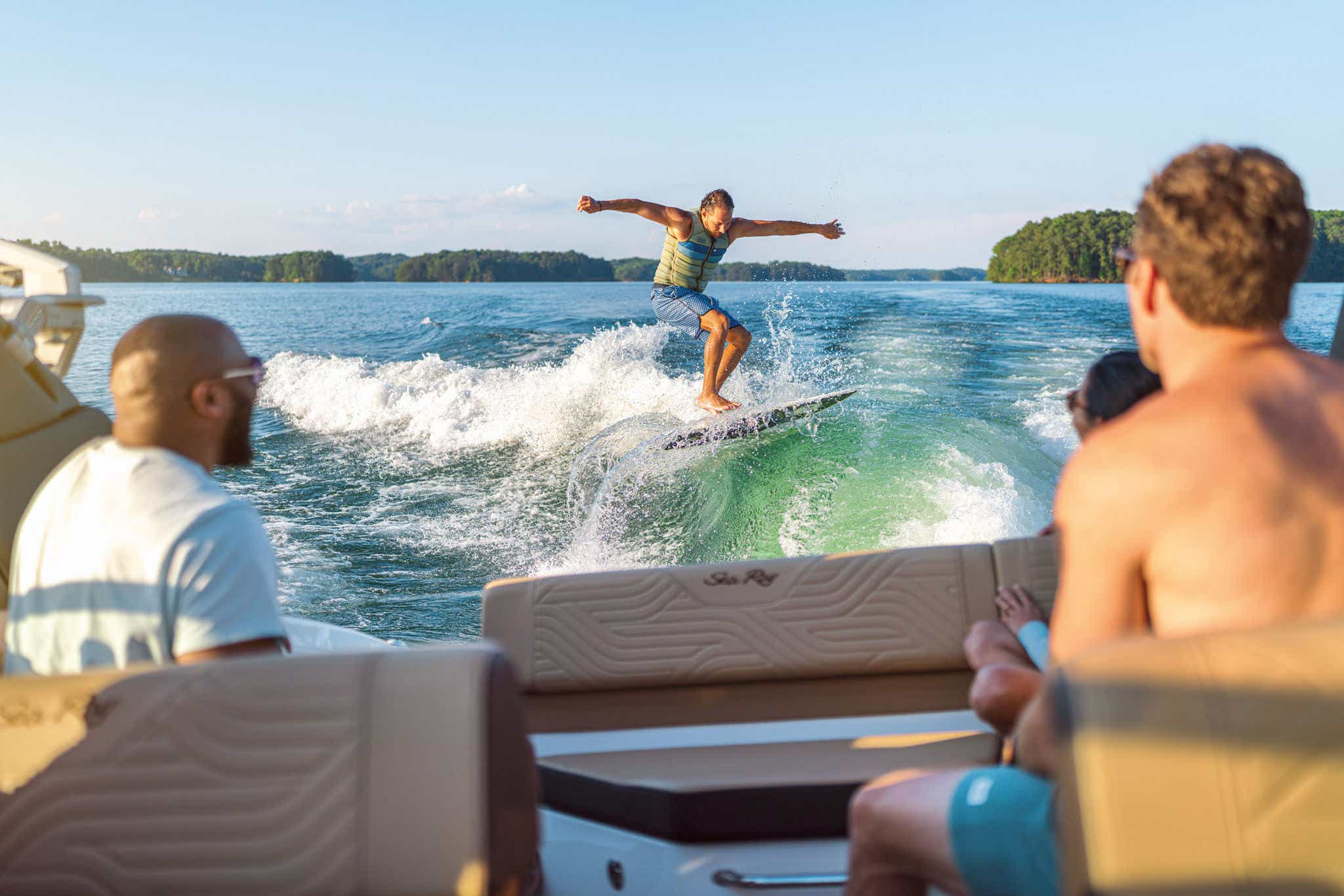 Man wakesurfing behind an SDX 250 Surf