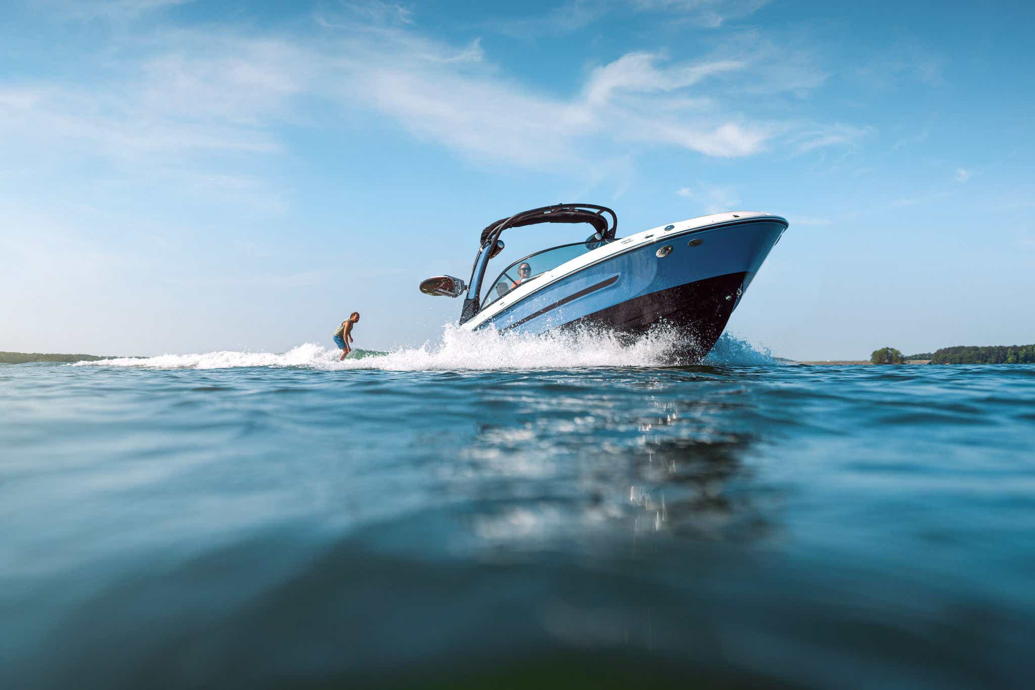 Man wakesurfing behind an SDX 250 Surf