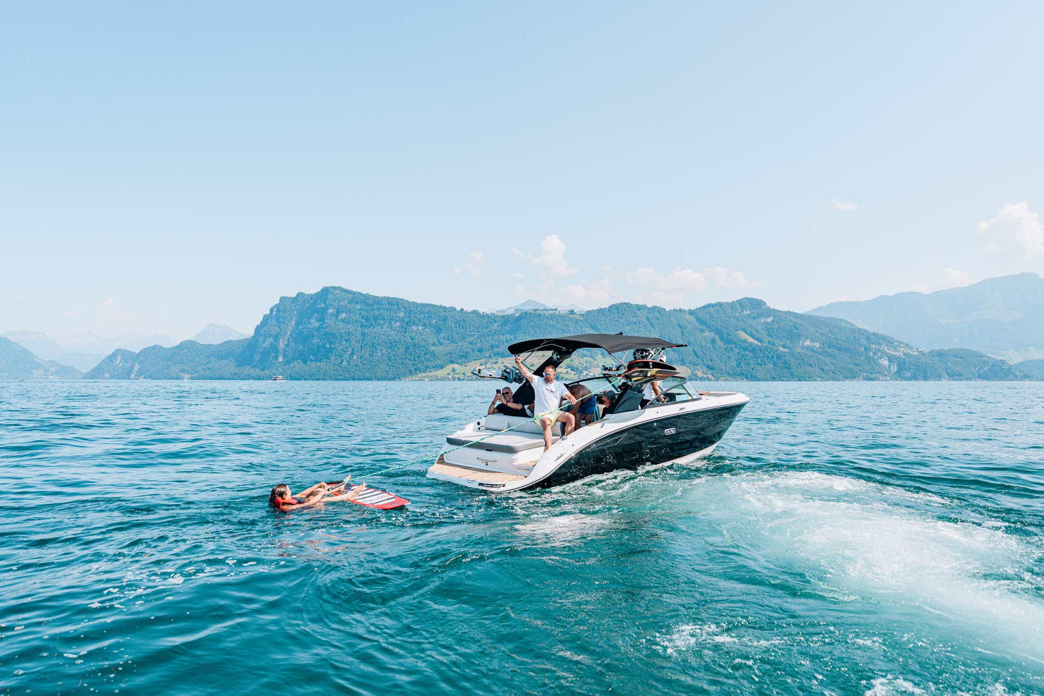Sea Ray boat with surfer behind