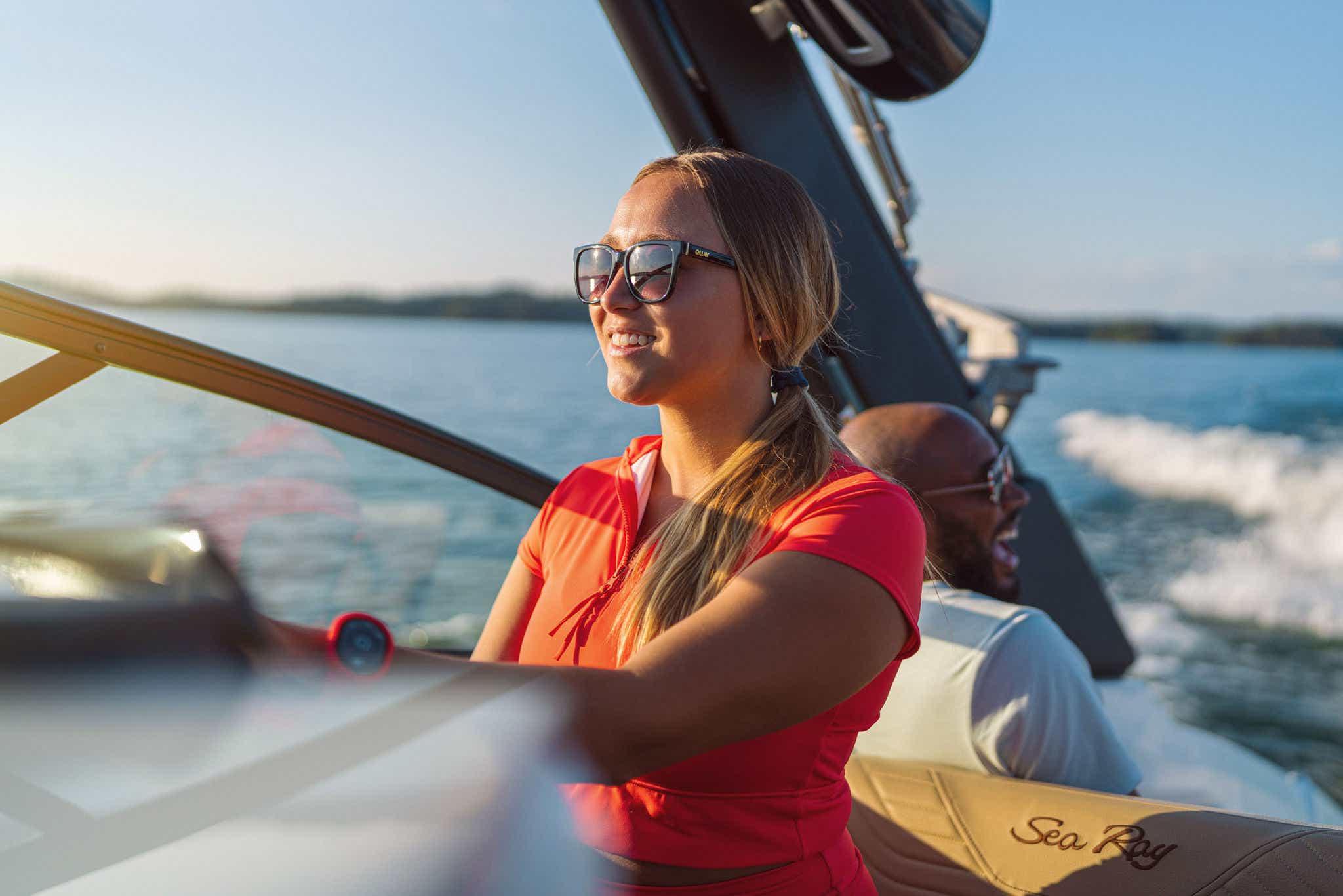 Woman at the helm of an SDX 250 Surf