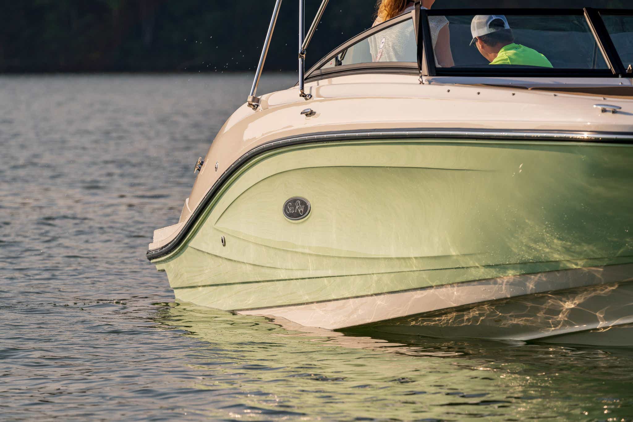 2024 SPX 230 starboard bow view of couple and Sea Ray logo