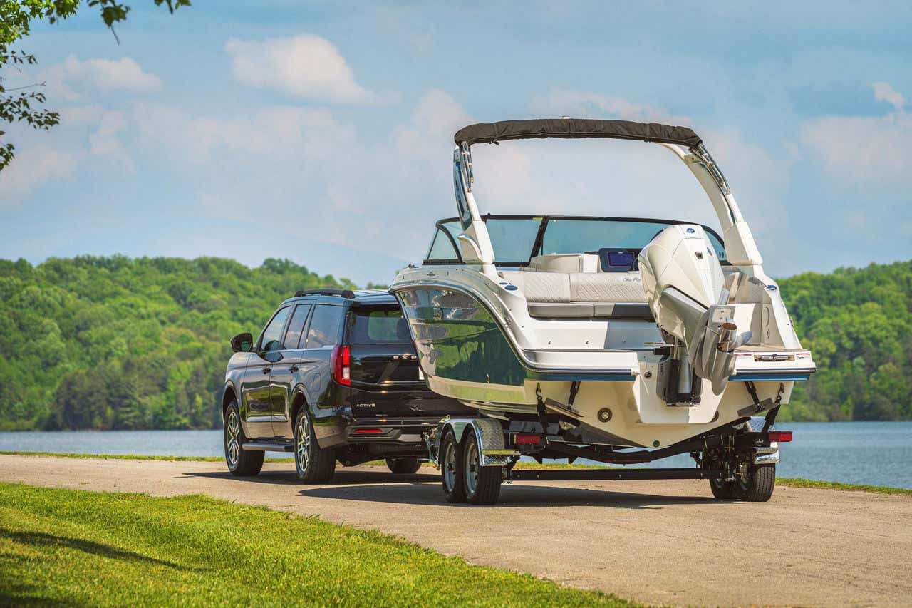 SUV pulling an SDX 230 Outboard on a trailer