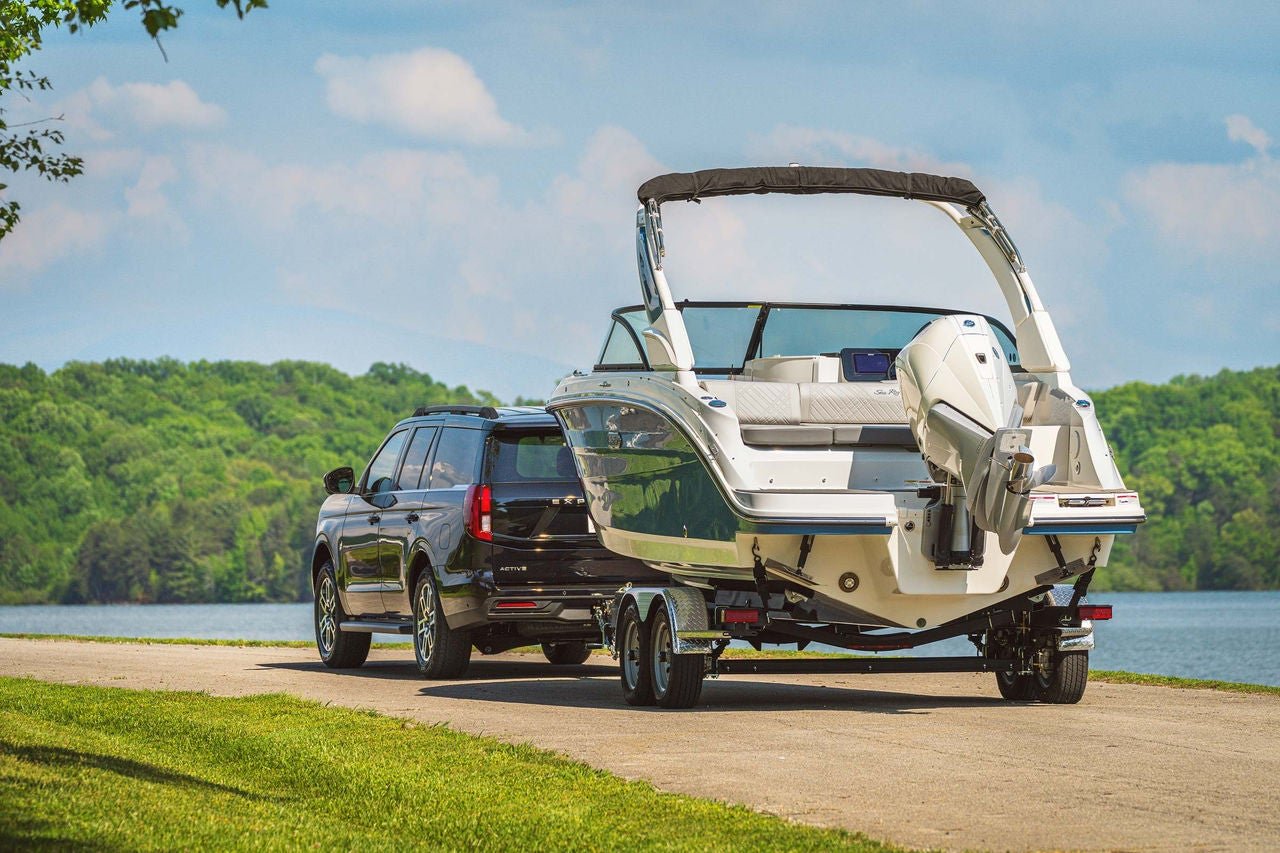 SUV pulling an SDX 230 Outboard on a trailer