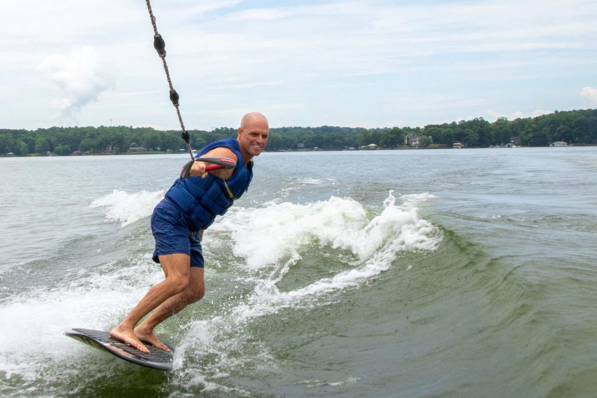 Shaun Murray Wake Surfing behind a Sea Ray boat