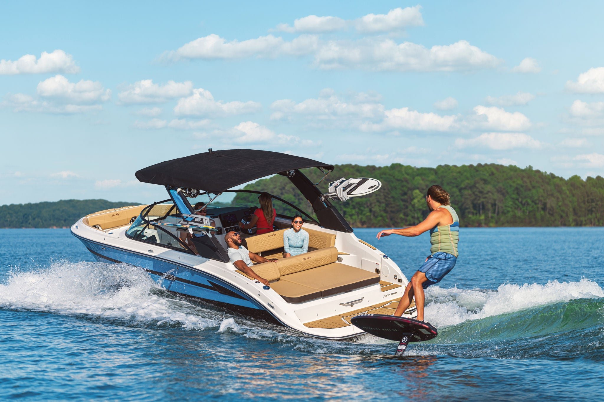 Man foilboarding behind an SDX 250 Surf