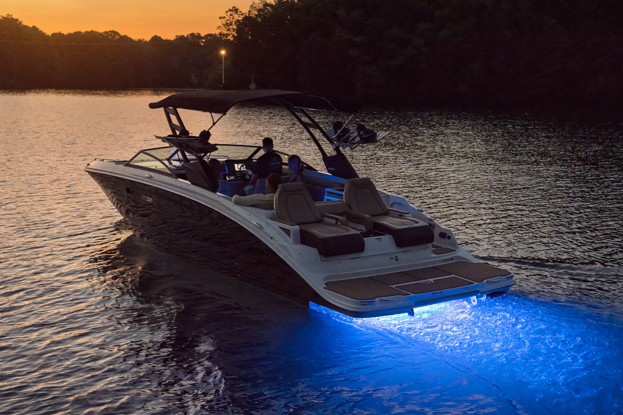 Family aboard an SDX 290 at twilight
