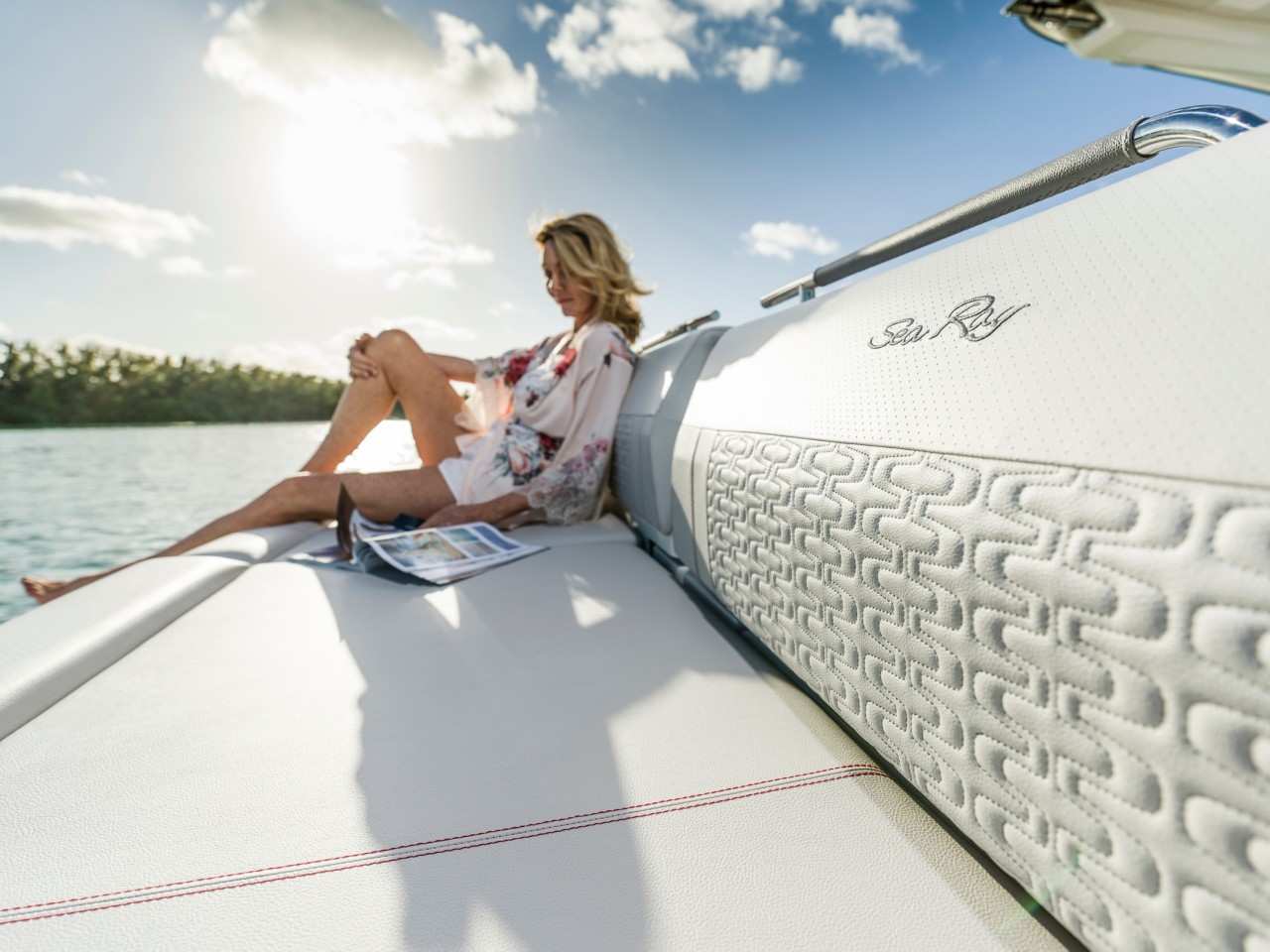 SLX-R-400-Outboard-sunpad-woman-reading-magazine