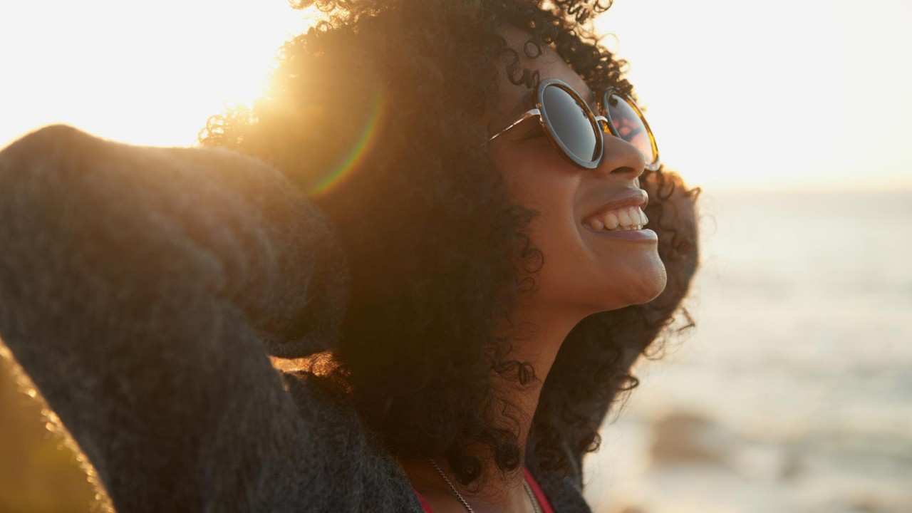 woman-sunlight-smile-sunglasses