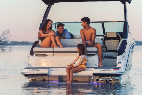 Family on Sea Ray SDX 210 Outboard Sport Boat, Starboard View at Sunset