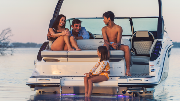 family on back of boat