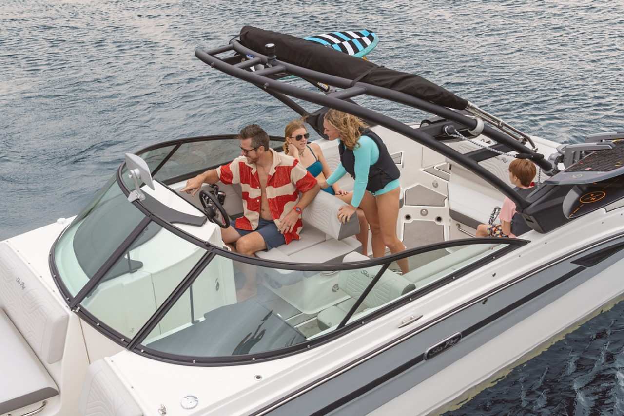 SDX 270 surf family at helm