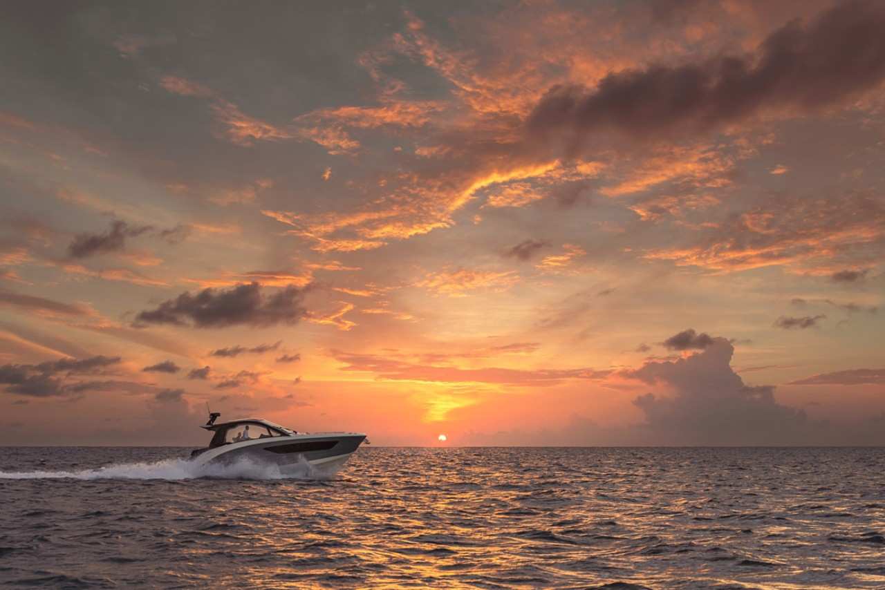 Sundancer 370 Outboard running starboard profile sunset