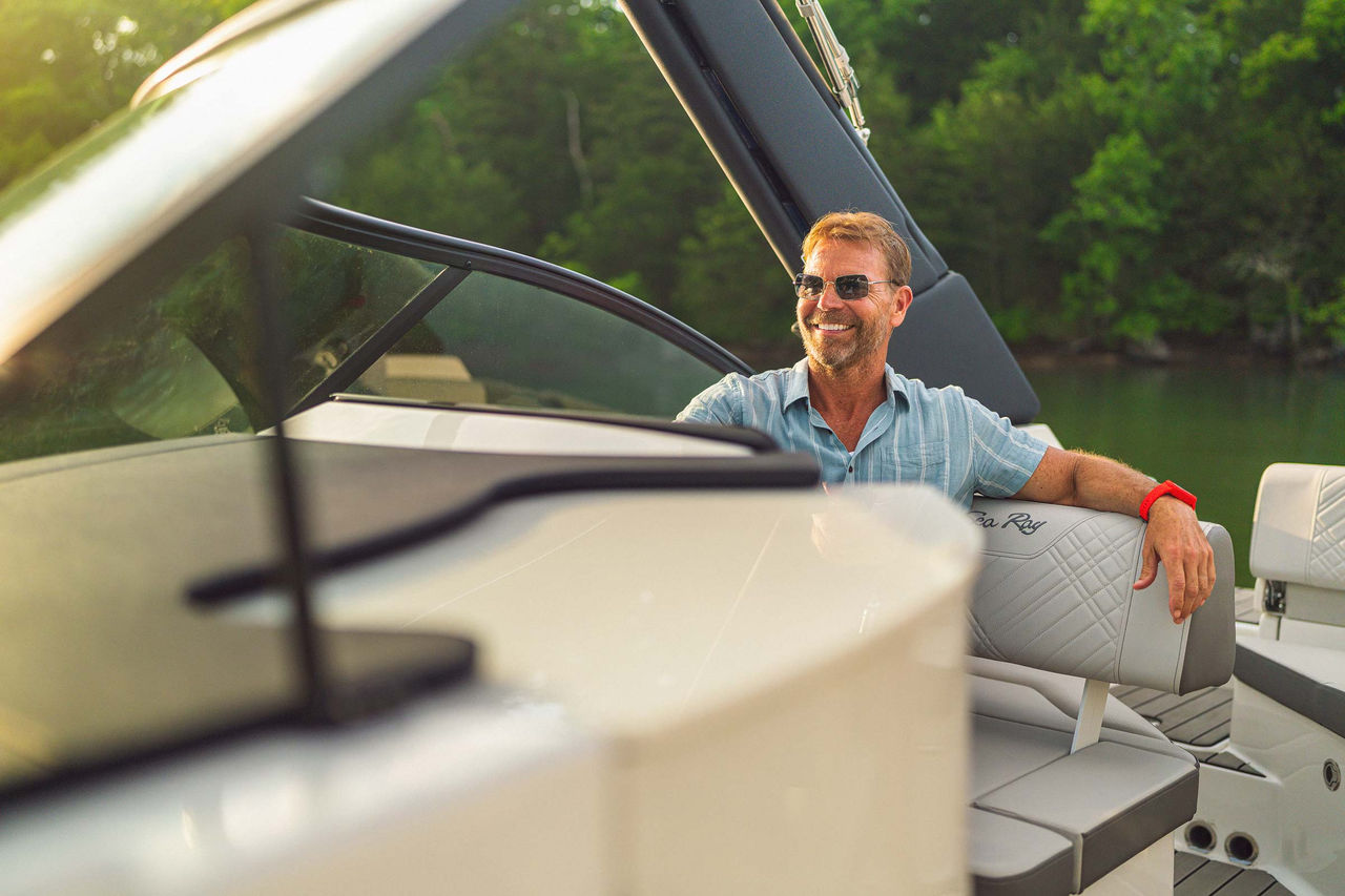 Man at the helm of an SDX 230