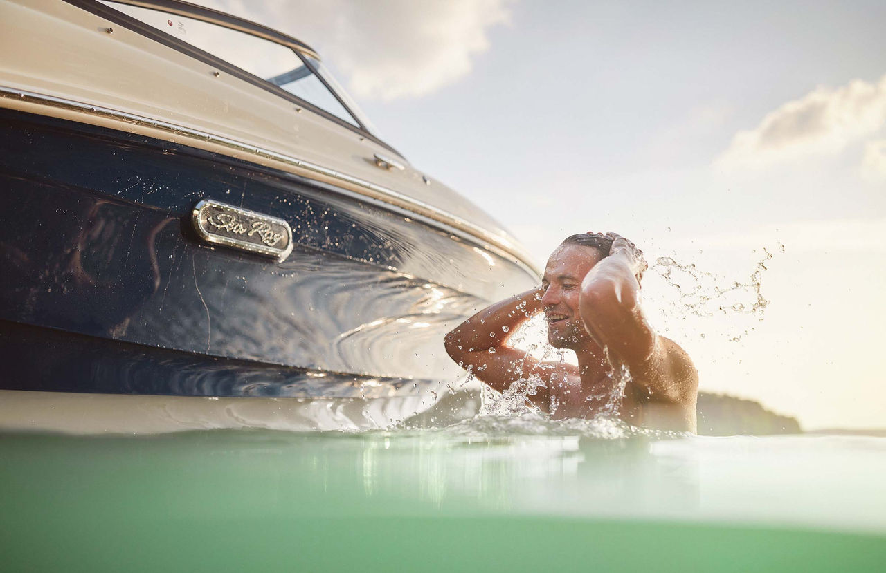 Man swimming next to an SPX 190 Outboard