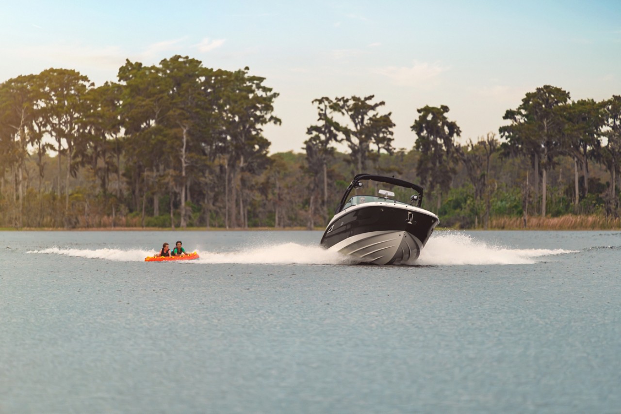 Friends tubing behind an SDX 270