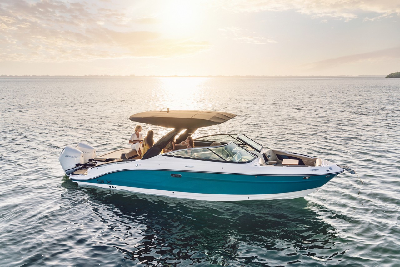 Women aboard an SLX 280 Outboard at sunset