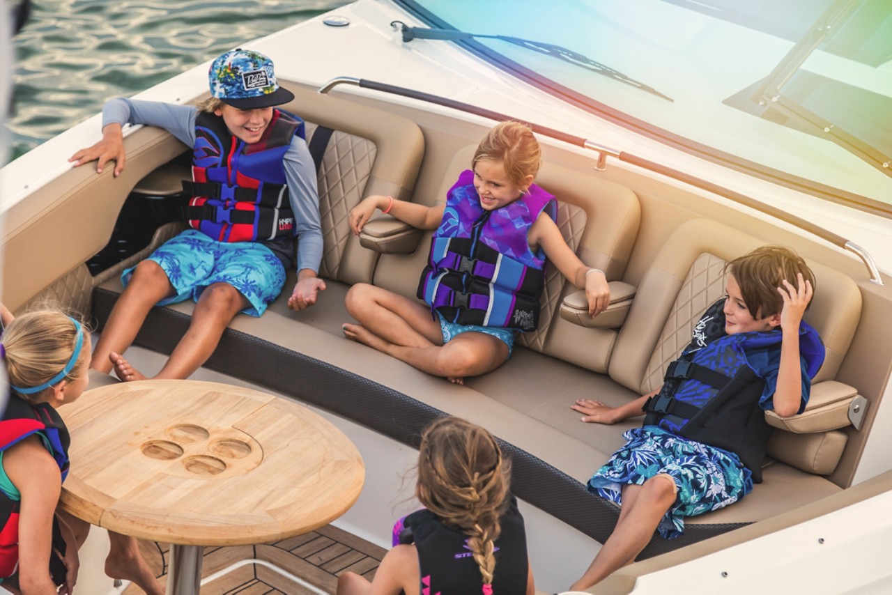 Kids at bow of 2024 SLX 400 Outboard