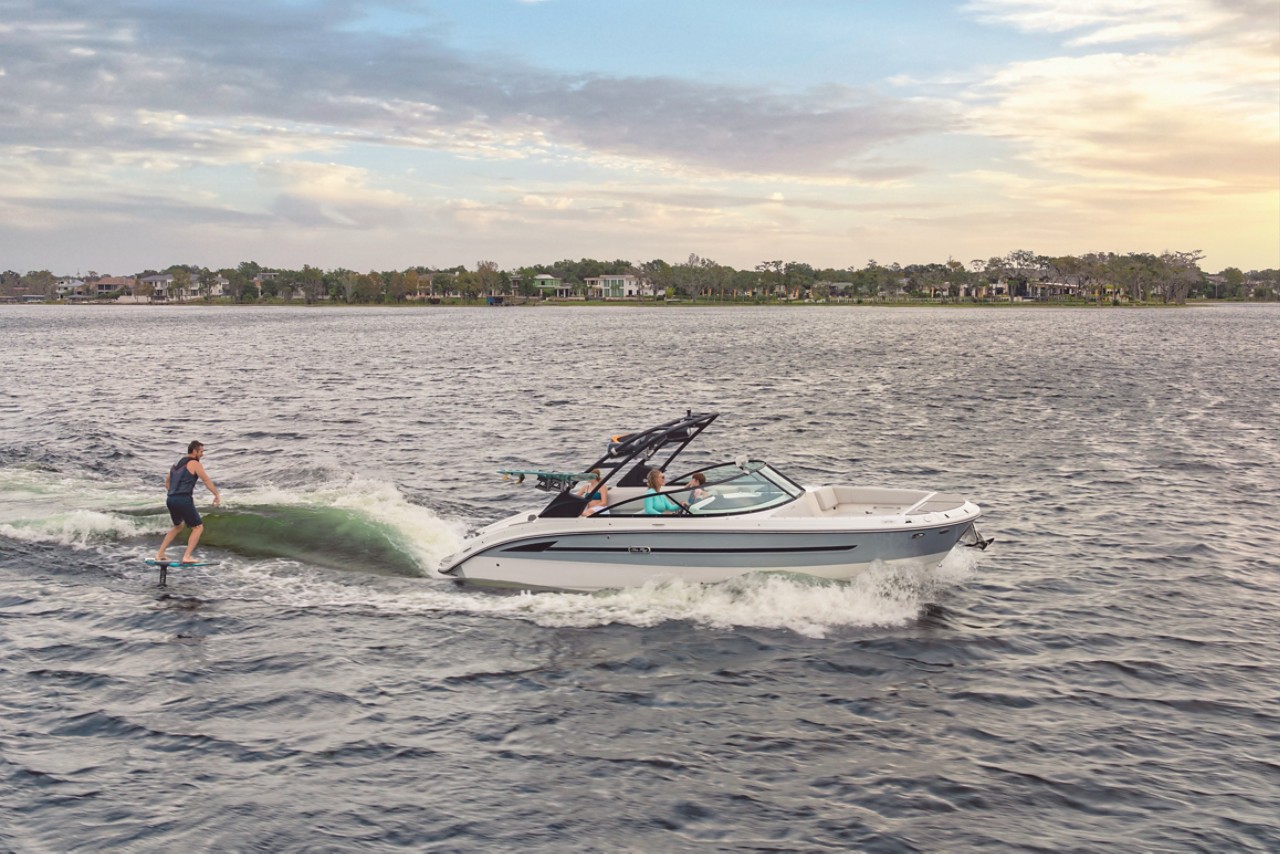 Man foilboarding behind an SDX 270 Surf