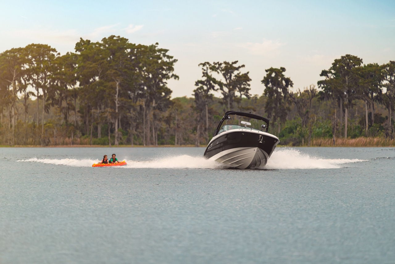 Friends tubing behind an SDX 270
