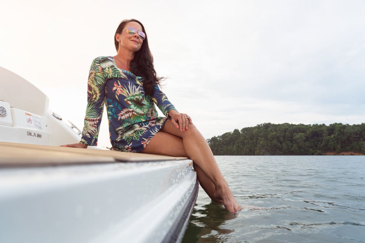 Woman at swim platform of 2024 SLX 350