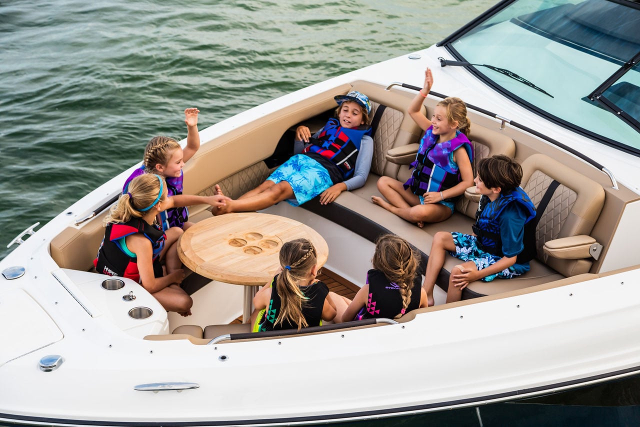 Kids at bow of 2024 SLX 400 Outboard