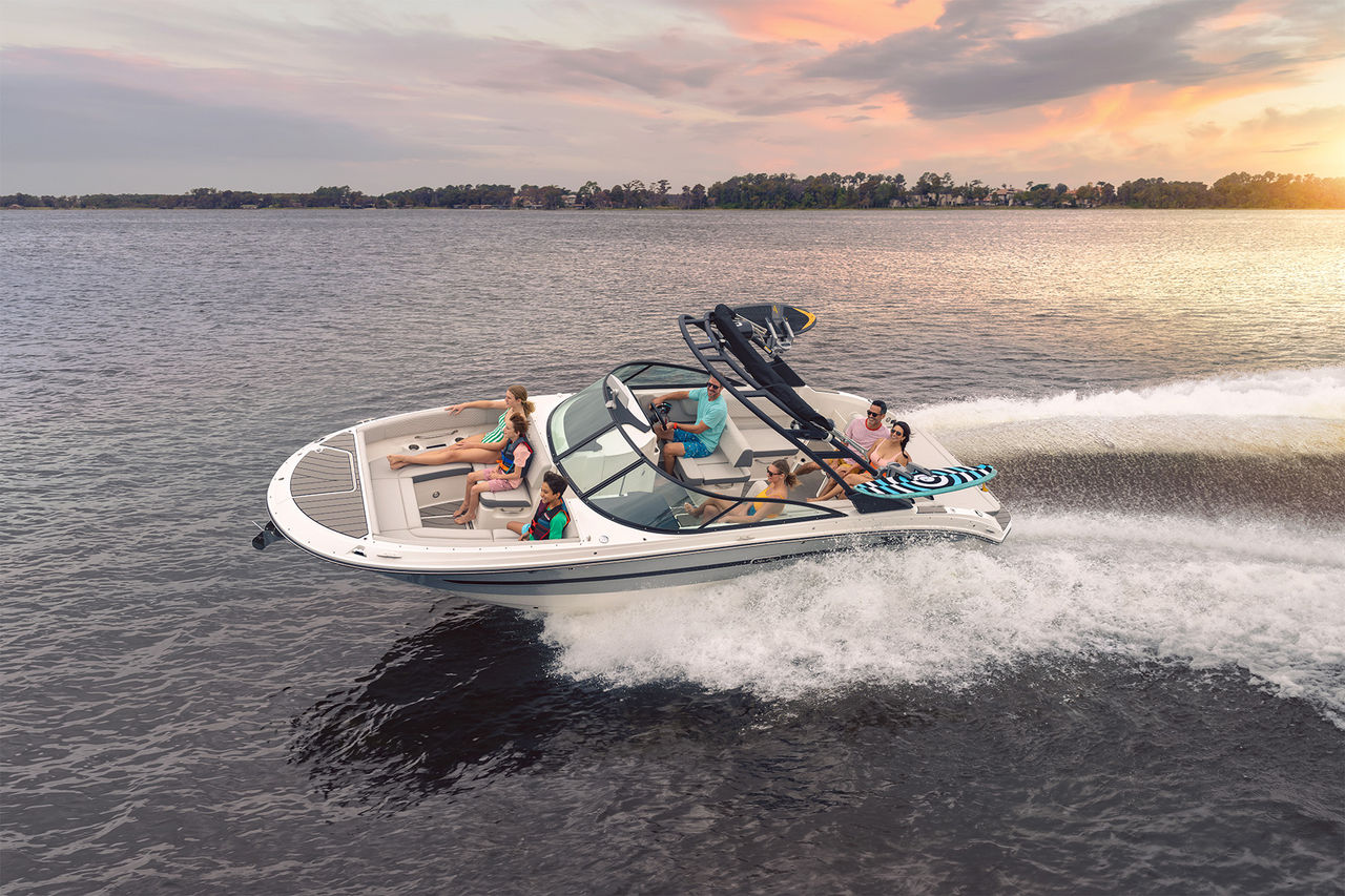 Sea Ray SDX 270 Surf boat running at sunset